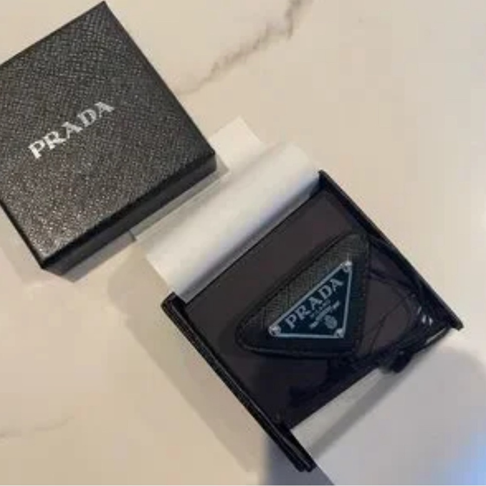 Prada enameled triangle pin with Saffiano trim Authentic